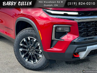 The 2025 Chevrolet Traverse Z71 in striking red is an AWD powerhouse designed for those who value an... (image 1)