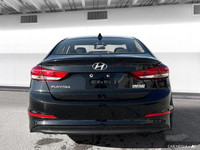 The 2017 Hyundai Elantra in Space Black Pearl features heated front seats, a heated leather steering... (image 4)