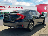 This 2019 Honda Civic Sedan EX boasts a stunning Cosmic Blue Metallic exterior and a sleek black fab... (image 5)