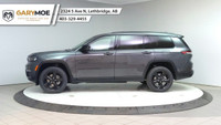 The 2025 Jeep Grand Cherokee L Limited 4x4, in a sophisticated gray, is designed to offer a commandi... (image 1)