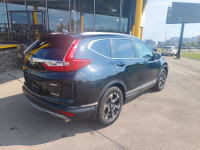 Summary The Touring represents the pinnacle of the 2019 CR-V lineup, offering a refined blend of per... (image 8)