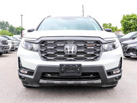 The 2023 Honda Passport TrailSport in stunning white is an all-wheel drive powerhouse designed for b... (image 1)