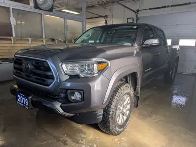 Get ready to conquer any terrain in this rugged and reliable 2019 Toyota Tacoma SR5 Crew Cab with a...