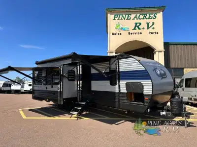 Forest River Cherokee travel trailer 274WK highlights: Kitchen Island Opposing Rear Slide Outs for a...