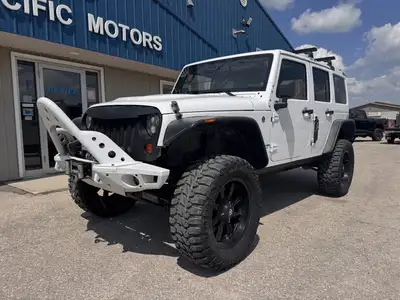 2013 Jeep Wrangler Unlimited Sahara 4x4 for sale at Pacific Motors near Winnipeg, MB DISCLAIMER: THI...