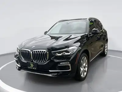 Step into the world of luxury and performance with the black 2021 BMW X5 xDrive40i Sports Activity V...