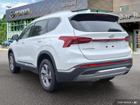 Experience the 2023 Hyundai Santa Fe Preferred SUV, boasting a stunning Quartz White exterior and bl... (image 2)