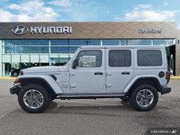 This 2023 Jeep Wrangler Sahara, a head-turner in Silver Zynith, offers both rugged capability and re... (image 1)