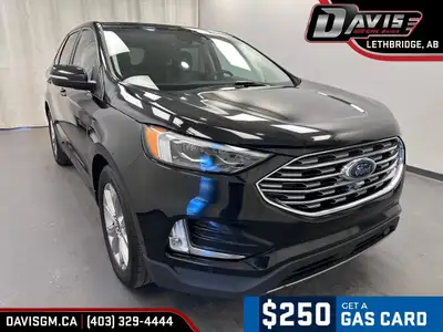 Blending confident performance, smart safety, and upscale amenities, the 2020 Ford Edge Titanium AWD...