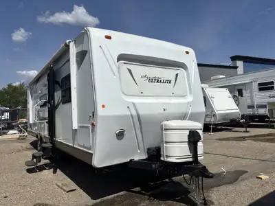 This 2011 travel trailer is waiting to be loved by it's new owners! The rear bathroom in this unit i...