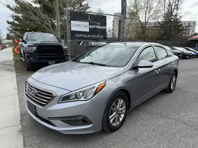 This 2016 Hyundai Sonata is a reliable sedan with a sleek gray exterior and a spacious interior in a...