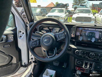This Jeep Wrangler has a dependable Regular Unleaded V-6 3.6 L/220 engine powering this Automatic tr... (image 9)