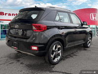 This 2022 Hyundai Venue Trend SUV boasts a sleek Space Black exterior and a practical, comfortable b... (image 5)