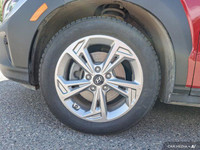 This 2022 Hyundai Kona Preferred SUV boasts a vibrant Pulse Red exterior and a sleek black interior.... (image 8)