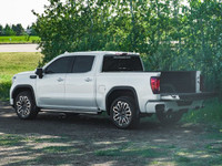The *2023 GMC Sierra 1500 Denali Ultimate* is a pre-owned powerhouse that effortlessly blends bold d... (image 5)