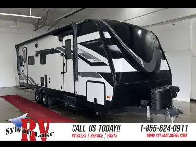 The 2023 Grand Design Imagine 2500RL is a rear-living travel trailer that blends residential comfort...