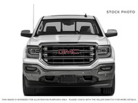 Powerful presence meets sophisticated comfort in the 2018 GMC Sierra 1500 SLT, graced with a Dark Sl... (image 2)