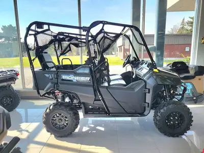 The Honda Pioneer 700-4 Dlx is a serious overachiever when it comes to putting in a hard days work o...