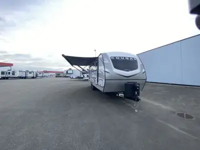 Keystone Cougar Half-Ton travel trailer 25RDSWE highlights: Private Bedroom 68in.in. Tri-Fold Sleepe...