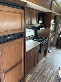 This opposing slides trailer is sure to impress anybody that walks through the door! This rear livin... (image 3)
