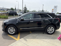 The 2024 Cadillac XT5 Luxury in Stellar Black Metallic combines refined styling with practical perfo... (image 4)
