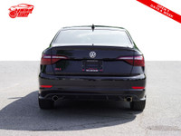 This 2021 Volkswagen Jetta GLI is a sleek sedan with a stylish black exterior and a sunroof for thos... (image 2)