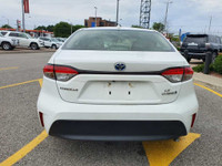Check out this 2023 Toyota Corolla Hybrid LE CVT with 27,670 KMS, finished in a sleek White exterior... (image 5)
