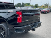 The 2022 Chevrolet Silverado 1500 LTD Custom Trail Boss in an adventurous black finish, powers throu... (image 3)