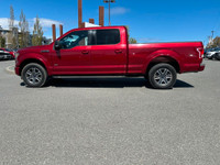 This 2015 Ford F-150 XLT has a Ruby Red Metallic exterior and Black Sport Interior with seating for... (image 2)