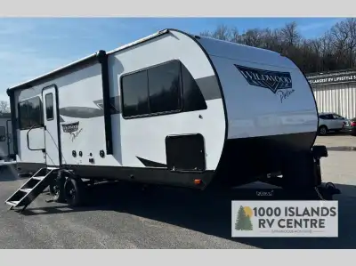 Forest River Wildwood travel trailer 22ERAS highlights: Rear Kitchen Walk-Through Bathroom Swiveling...