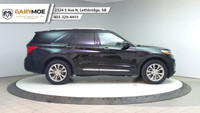 The 2024 Ford Explorer Limited 4WD in sleek black is a robust yet stylish SUV designed to conquer bo... (image 5)