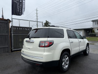 This 2014 GMC Acadia SLE-2 is a spacious and reliable SUV with a sleek white exterior and a comforta... (image 4)