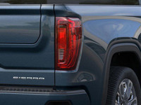 The 2025 GMC Sierra 1500 Denali Ultimate, finished in Downpour Metallic with a refined Alpine Umber... (image 2)