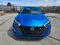 Buckle up, because this 2023 Nissan Versa SR CVT in Electric Blue Metallic isnt just a carits your t... (image 9)