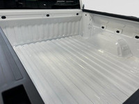 This 2025 GMC Sierra 1500 in Summit White is equipped with 4WD and Turbocharged Gas I4 2.7L/166 engi... (image 9)