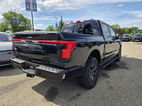 This brand new ANTIMATTER BLUE METALLIC 2025 FORD F-150 LIGHTNING LARIAT is powered by an ELECTRIC E... (image 7)