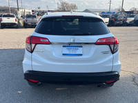 Elevate your driving experience with the striking White Honda HR-V Sport, featuring an All-Wheel Dri... (image 3)