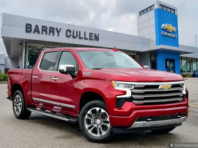 The Chevrolet Silverado 1500 High Country in radiant red is a powerhouse of performance and style. B...