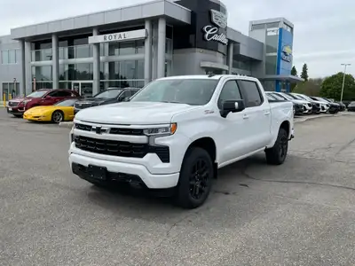 The 2025 Chevrolet Silverado 1500 RST in pristine white with a 44 drivetrain delivers robust handlin...