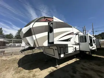 3 SLIDES, FULL WINTER PACKAGE, SOLID SURFACE COUNTERTOPS AND MUCH MORE. Fully serviced in and out an...