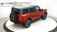 Experience the power and style of the red 2023 Ford Bronco Outer Banks 4 Door Advanced 4x4, boasting... (image 9)