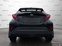 This sleek 2021 Toyota C-HR boasts a stylish black exterior and is ready to elevate your daily commu... (image 5)
