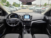Step into the 2017 Ford Escape SE, a black, front-wheel drive SUV that delivers consistent handling... (image 2)