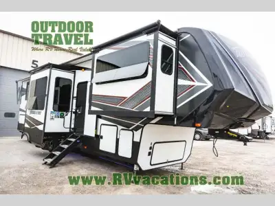Grand Design Momentum 376TH toy hauler highlights: Kitchen Island Fireplace Outside Kitchen and TV E...