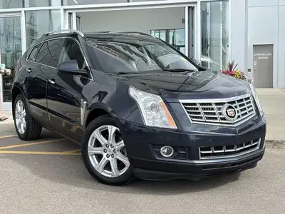 The 2015 Cadillac SRX Premium Collection, shown in Sapphire Blue Metallic, delivers confident perfor...