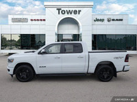 Unleash the power of the 2023 Ram 1500 Sport Crew Cab. This head-turning Bright White truck boasts a... (image 2)