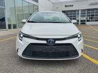 Check out this 2023 Toyota Corolla Hybrid LE CVT with 27,670 KMS, finished in a sleek White exterior... (image 2)