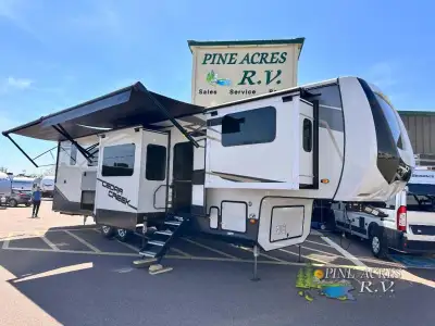 Forest River Cedar Creek fifth wheel 371FL highlights: Fireplace Televator 2 A/Cs Solar Panel System...