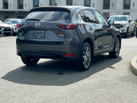 This 2021 Mazda CX-5 Signature has a Grey Exterior and Brown Interior with seating for 5. Equipped w... (image 7)