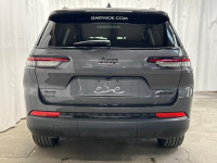 The 2025 Jeep Grand Cherokee L Limited 4x4 in sophisticated gray with its smooth 4x4 drivetrain prom... (image 4)